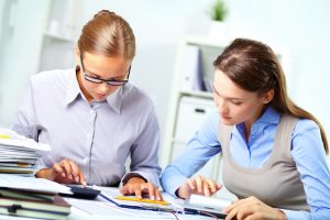 two people reviewing paperwork