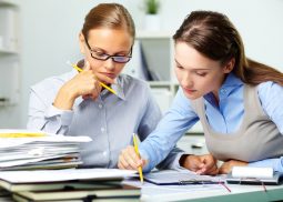 two people reviewing paperwork